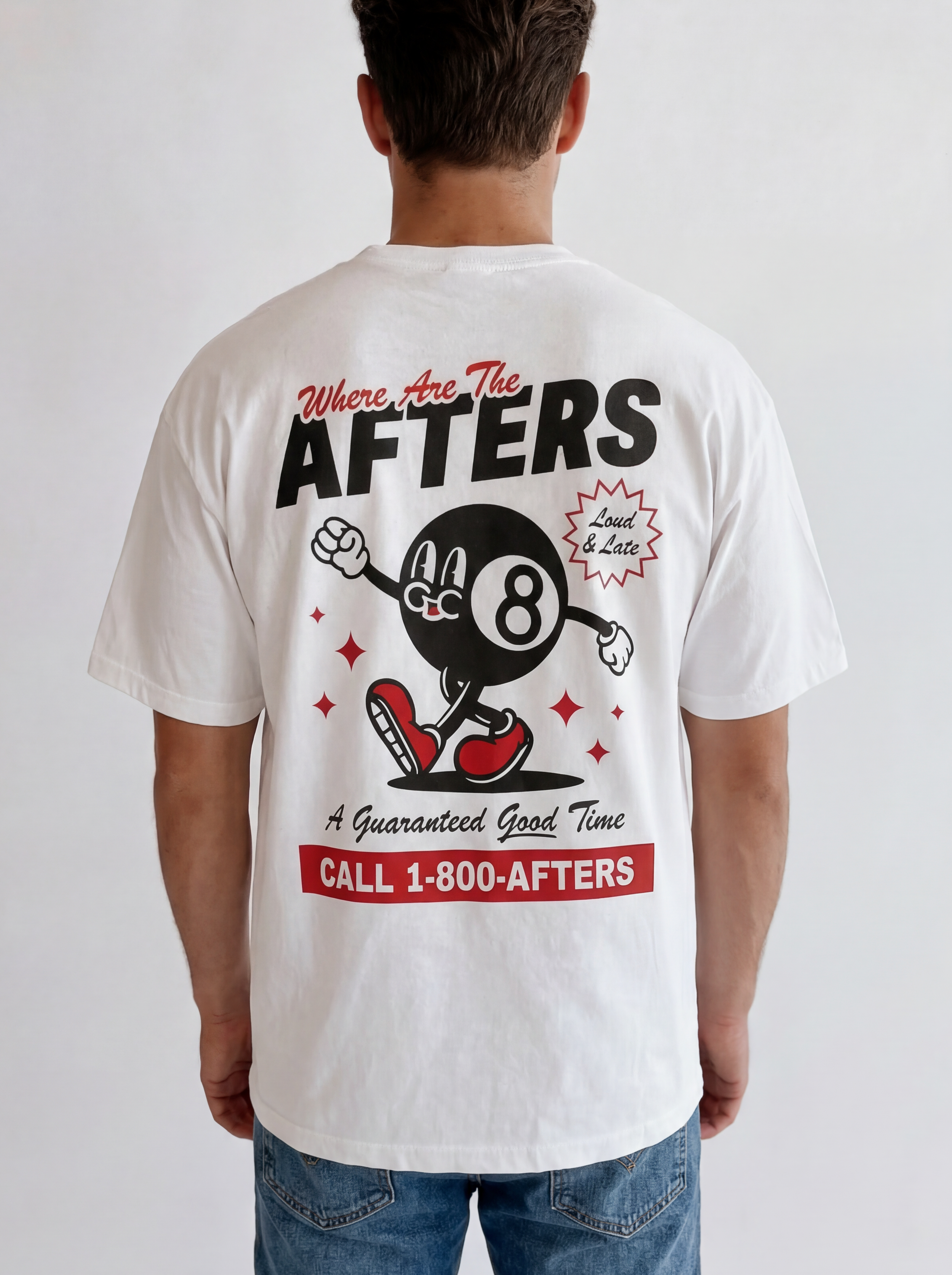 Person wearing a white t-shirt with a graphic design and text on the back, standing against a plain background.